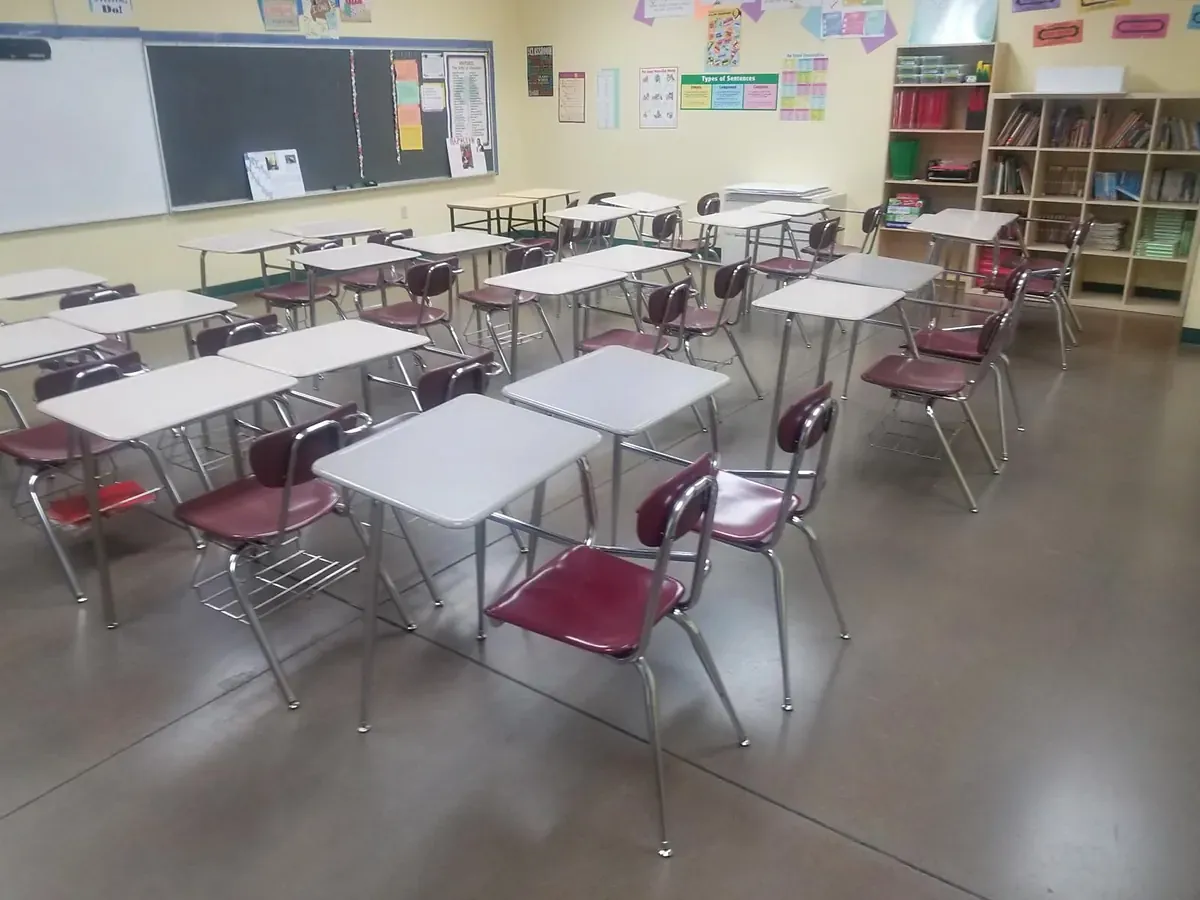 Empty classroom with rows of desks