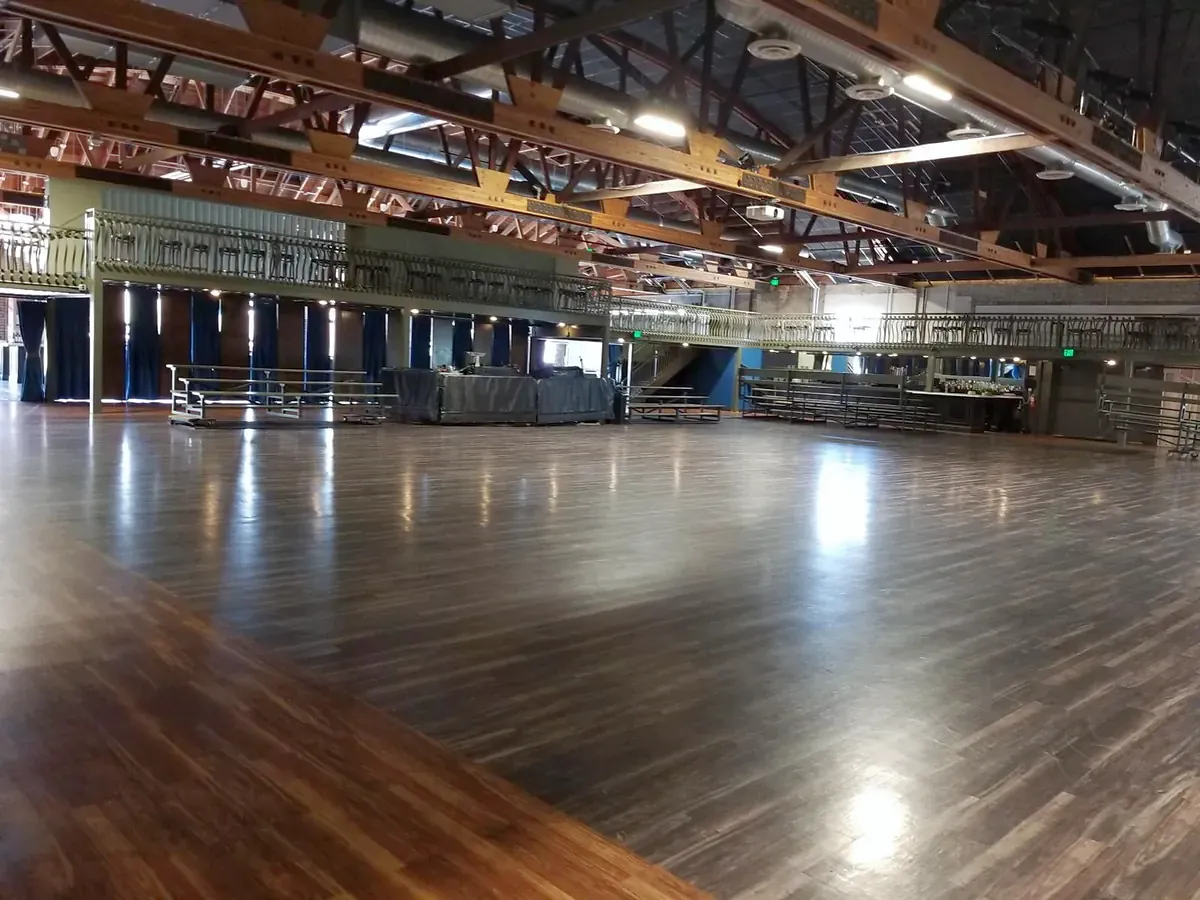 Large event hall with a reflective wood floor